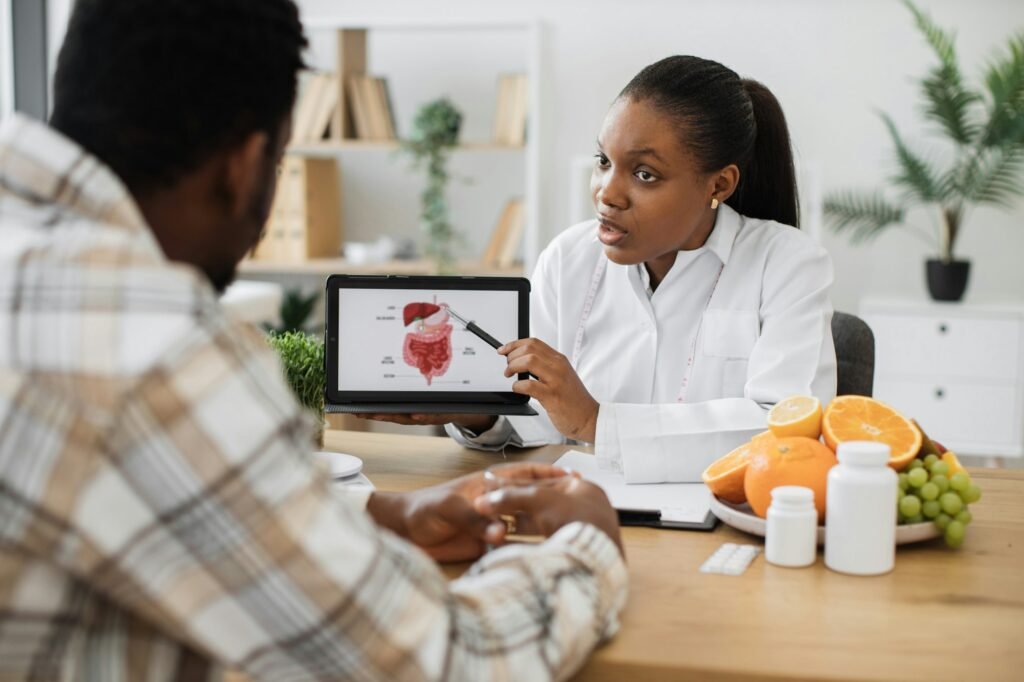 Woman holding tablet with GI tract while counseling client
